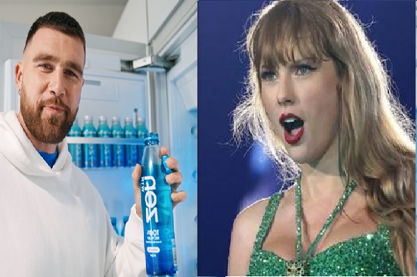 Travis Kelce holding a bottle water for Taylor Swift