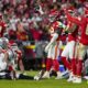 Kansas City Chiefs linebacker Nick Bolton (32) holds the recovered ball after a fumble