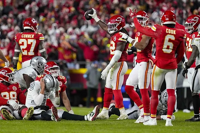 Kansas City Chiefs linebacker Nick Bolton (32) holds the recovered ball after a fumble